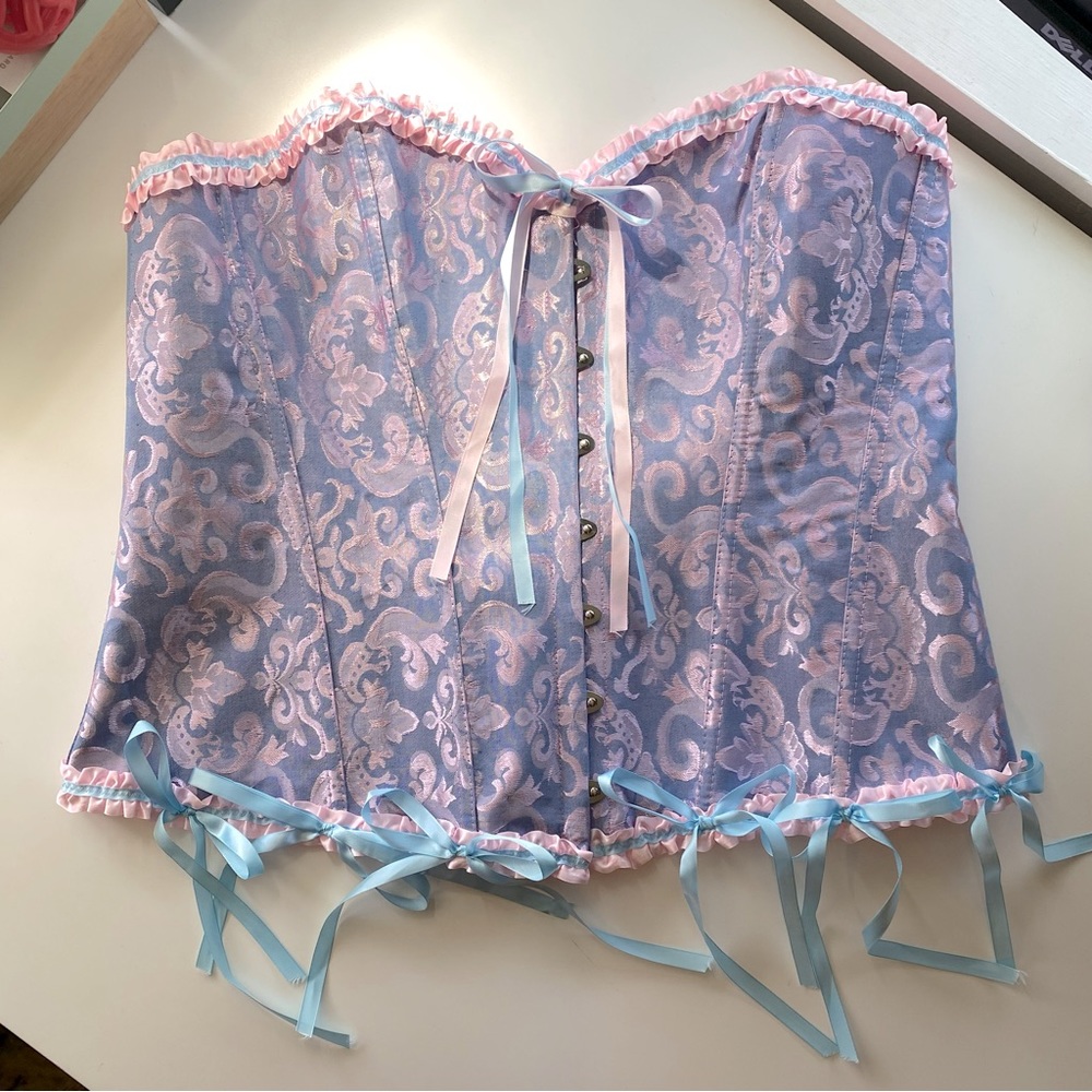 Pink and blue corset with ruffles and bows